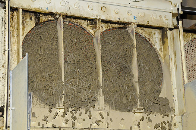 Pieces of clay being sent to extrusion