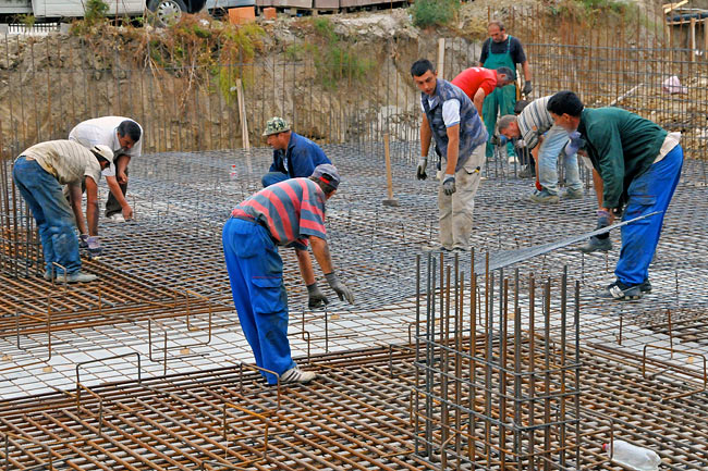 Placing the second layer of iron mesh
