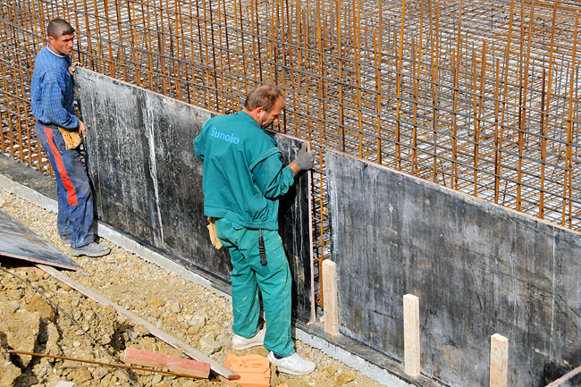 Installing the cast around the armed concrete base slab