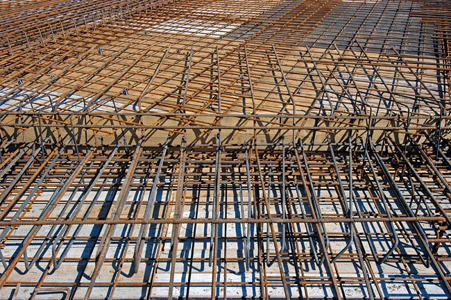 Special iron beams making the strong connection between the 2 levels of the slab